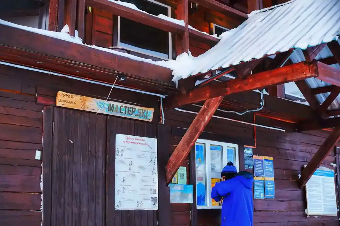 Skis and snowboards by the rental shop